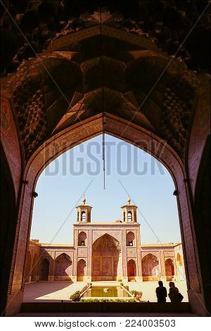 Iran, Shiraz, Mosque Nasir al-Mulk - September 17, 2016: Tourists and persian locals in a multi-colored mosque Nasir al Mulk.