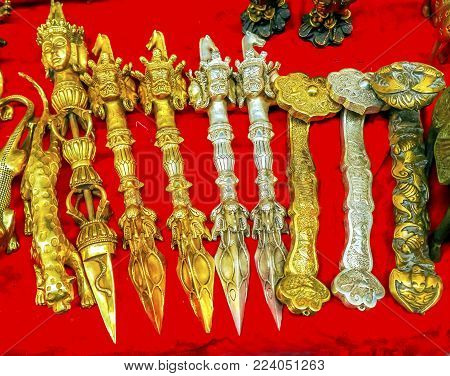 Chinese Replica Buddhist Knives Decorations Panjuan Flea Market  Decorations Beijing China.  Panjuan Flea Curio market has many fakes, replicas and copies of older Chinese products, many ancient.