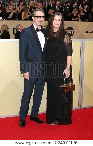 LOS ANGELES - JAN 21:  Gary Oldman, Giselle Schmidt at the 24th Screen Actors Guild Awards - Press Room at Shrine Auditorium on January 21, 2018 in Los Angeles, CA
