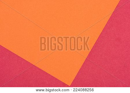 close-up shot of orange and purple paper layers for background