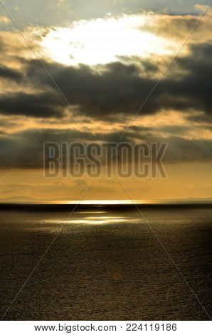 Captivating view of the waters in Scotland with the sunlight breaking through the clouds