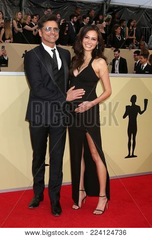 LOS ANGELES - JAN 21:  John Stamos, Caitlin McHugh at the 24th Screen Actors Guild Awards - Press Room at Shrine Auditorium on January 21, 2018 in Los Angeles, CA