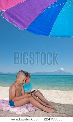 Young Boy Girl Playing Smartphone Beach shade