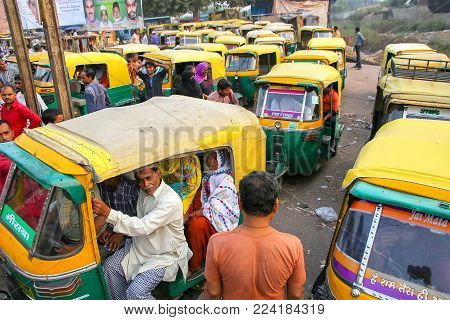 AGRA, INDIA - NOVEMBER 10: Unidentified people sit in tuk-tuks at Kinari Bazaar on November 10, 2014 in Agra, India. Agra is one of the most populous cities in Uttar Pradesh