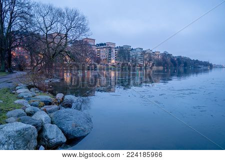 Water lights reflection of Norr Mälarstrand, Stockholm, January 2018