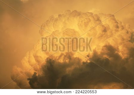 Dramatic sky with big clouds above Pasterka village in Table Mountain in Poland. Stormy weather, nat