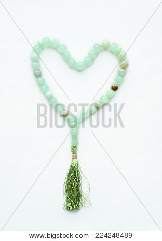 Muslim rosary of decorative stone folded in the shape of a heart
