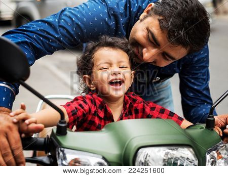 Young Indian boy riding the motobike