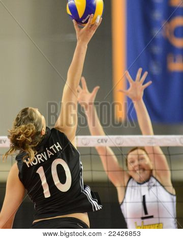 DEBRECEN, HUNGARY - JULY 9: Dora Horvath (in black 10) in action a CEV European League woman's volleyball game Hungary (black) vs Israel (white) on July 9, 2011 in Debrecen, Hungary.