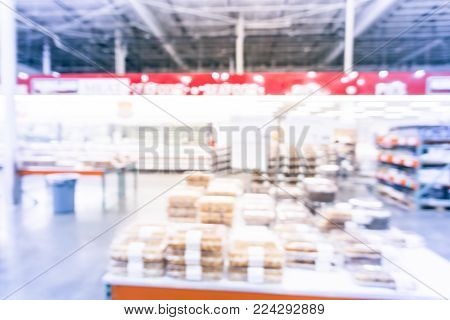Blurred Variety Of Cakes, Cookies And Desserts On Display Rack At Wholesale
