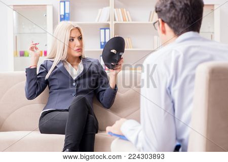 Young woman visiting psychiatrist man doctor for consultation