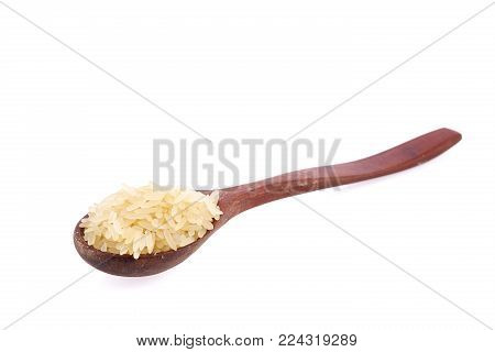 white rice in wooden spoon isolated on white
