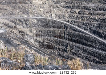 A road cut through the walls of a stone quarry