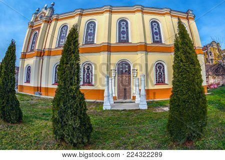 ORADEA, ROMANIA - JANUARY 27, 2018: Back exterior of the Orthodox Synagogue with traditional columns place for wedding. It was built in 1890 after the plans of Knapp Ferencz in neo-maorical style.