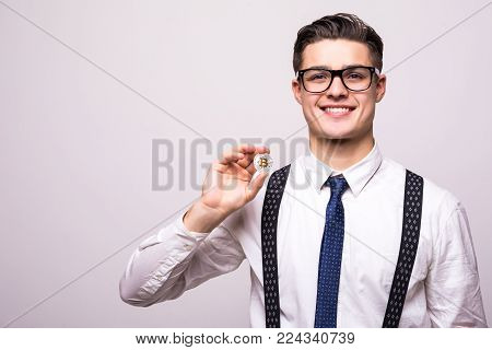 Golden Bitcoin In A Man Hand, Digitall Symbol Of A New Virtual Currency. Man Pointed Bitcoin On Whit
