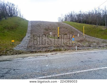 Outskirts of the city of Novorossiysk, Russia - March 10, 2017: A clearing in the forest for the gas pipeline. Underground gas pipeline.