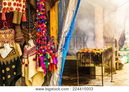 View on locals products and barbecue on market in Chichicatenango - Guatemala