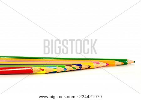 colored pencils are in a different order on a white background