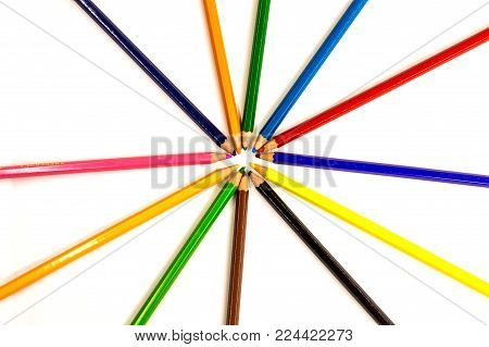 colored pencils are in a different order on a white background