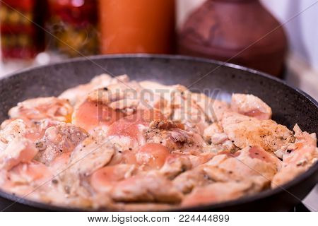 Close-up view of pieces roasting chicken fillet, selective focus