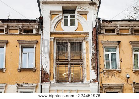 travel to Russia - shabby urban house of traditional Moscow architecture of the early 20th century on Chaplygin Street in Moscow city in winter