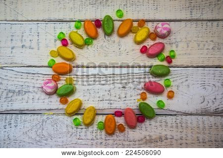 assorted chocolates arranged on a background for greeting card , site header, concept sweet celebration of love