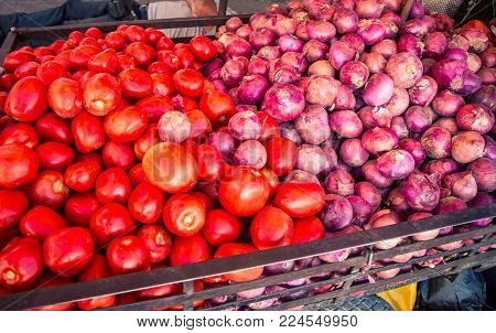 Tomatoes and red onions at a market in Cajamarca Peru