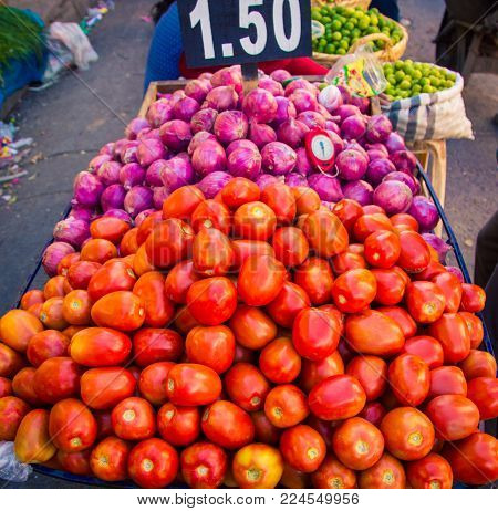 Tomatoes and red onions at a market in Cajamarca Peru