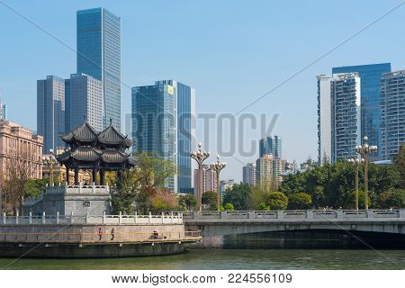 Chengdu, Sichuan Province, China - March 27, 2016 : HeJiang pavilion and skyscrapers in Chengdu on a sunny day.