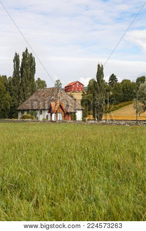 Heddal village on hills in Norway, horizontal picture.