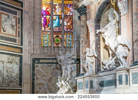 Milan, Italy - October 27, 2016: The interior of the Duomo Cathedral, the sculptural group of San Giovanni Bosco, by Vincenzo Buzzi