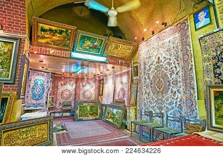 SHIRAZ, IRAN - OCTOBER 12, 2017: The  framed tapestries with reproductions of famous pictures and Persian carpets are perfect decorative details for different interiors, Vakil Bazaar, on October 12 in Shiraz.