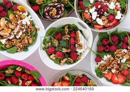 High angle view of bowls with fruit salad on table presented conceptually