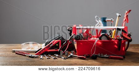 Toolbox With Different Worktools Against Grey Background