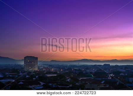 Landmark of Purwokerto city in Banyumas regency, Central Java at dawn before sunrise. Cityscape aerial view in misty morning