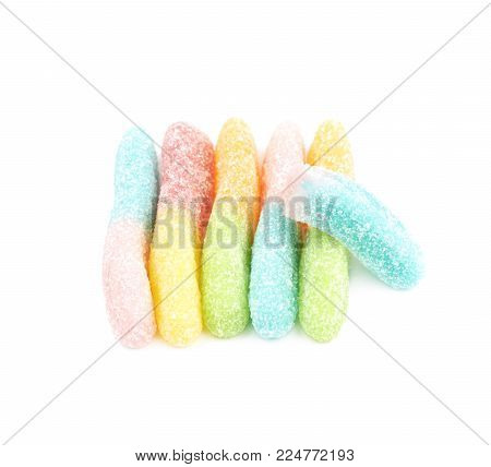 Measured portion of exactly hundred calories of the jelly worm sour sugar candy isolated over the white backgound