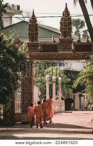 Buddhist temple gate with buddhist monks Cambodia, Siem Reap