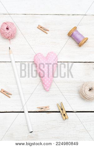 Objects for creativity on a white wooden background. Vertical photo