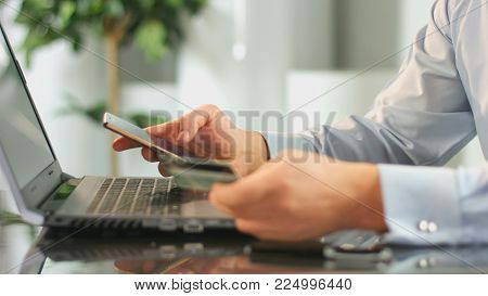 Man making online payment from bank account, using mobile app on smartphone HD