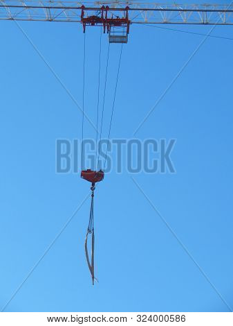 Empty Crane Winch. Abstract Industrial Background With Construction