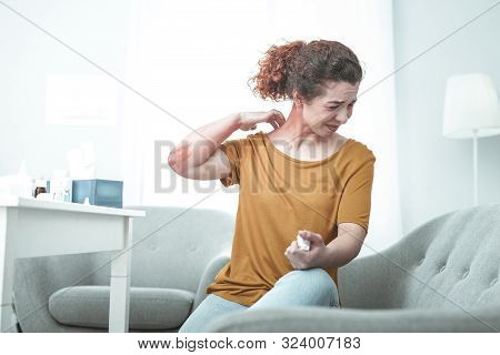 Curly Woman Suffering From Strong Allergy To Dust And Chemicals