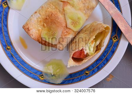 Half Eaten Vegetable Sandwich Served At Plate/ Half Eaten Lunch