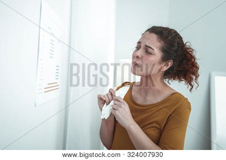 Curly Woman Holding Napkin While Having Strong Allergy