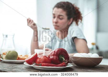Curly Red-haired Woman Having Allergy To Red Vegetables