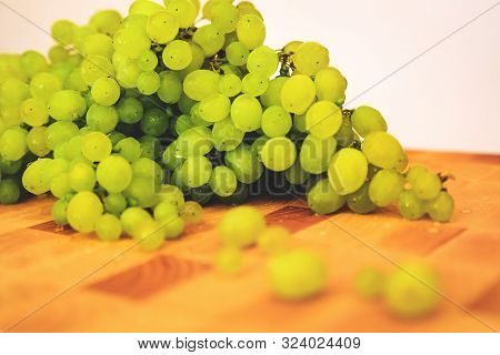 Green Grape On The Wooden Cutting Board