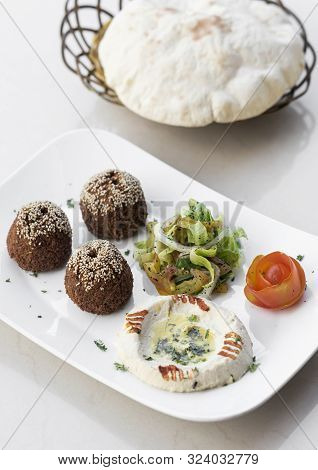 Organic Falafel And Hummus Starter Snack Food Mezze Platter On White Table