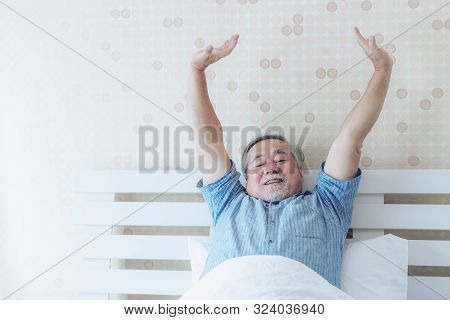 Senior Man Feel Happy Good Health Wake Up In The Morning Enjoying Time In His Home Indoor Bedroom Ba