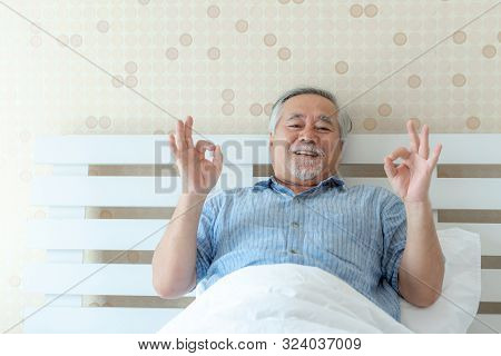Senior Man Feel Happy Good Health Wake Up In The Morning Enjoying Time In His Home Indoor Bedroom Ba