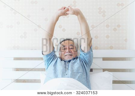 Senior Man Feel Happy Good Health Wake Up In The Morning Enjoying Time In His Home Indoor Bedroom Ba