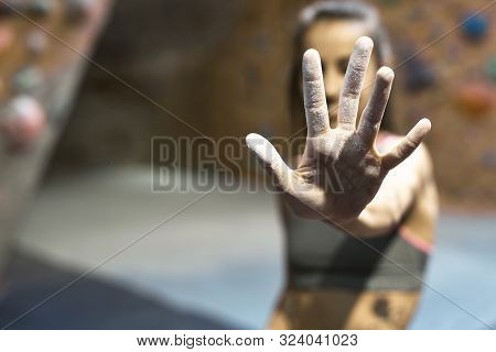 Woman Hands In White Chalk Powder. Athletic Woman Getting Ready To Climbing. Focus On The Hand.